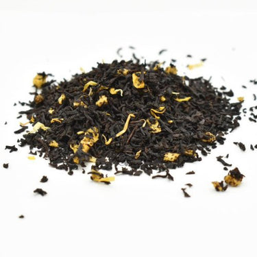 Mango in Black Loose Leaf Tea 🕶️ features black tea with yellow flower petals and dried mango pieces—a vibrant, high-caffeine brew for bold flavor lovers.